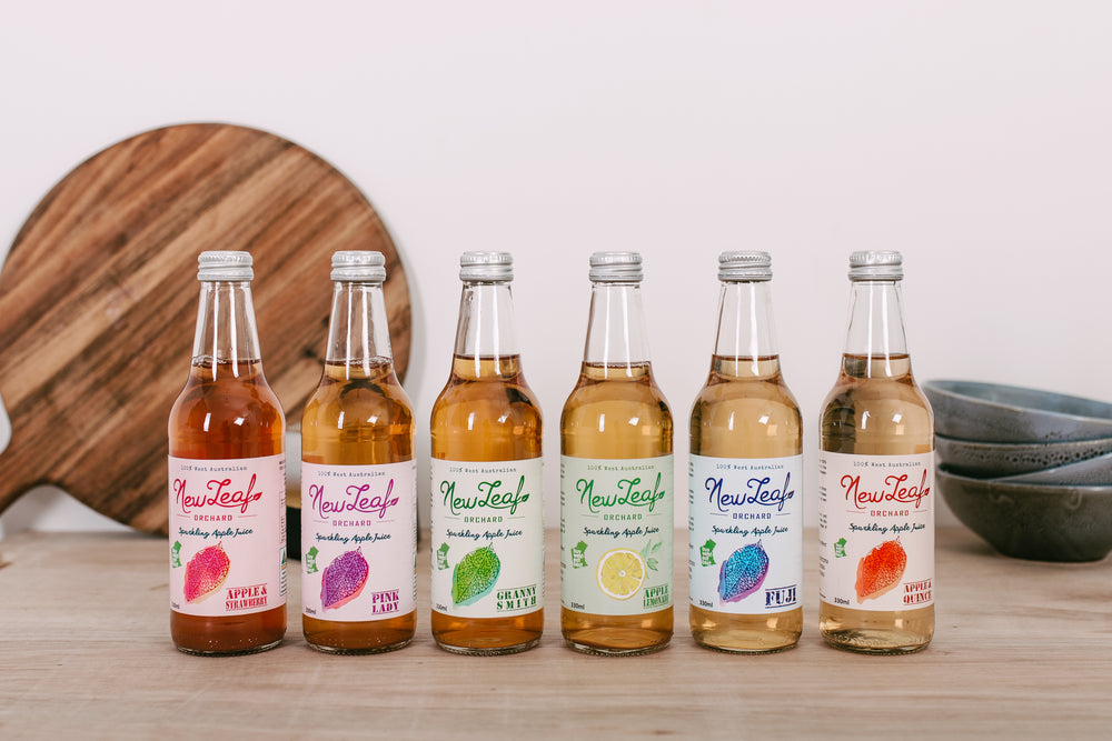 NewLeaf Orchard sparkling juices lined up in a row
